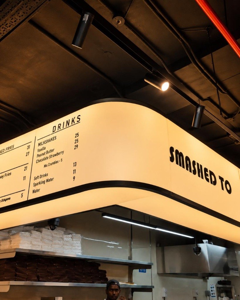 L&eacute;Nar Burgers illuminated interior menu and kitchen